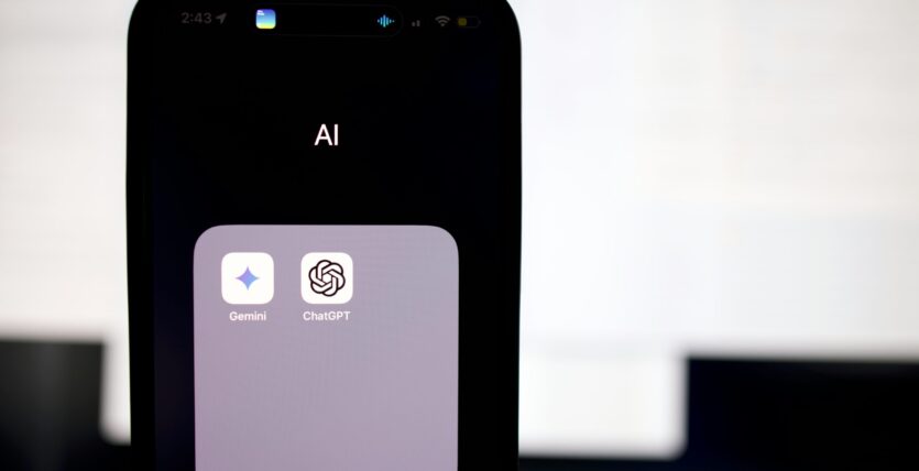 a close up of a cell phone with an ai button