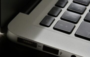 Free Detailed view of a silver laptop showing keyboard and multiple ports. Stock Photo